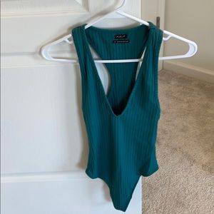 Out from under thong body suit, deep V-Neck